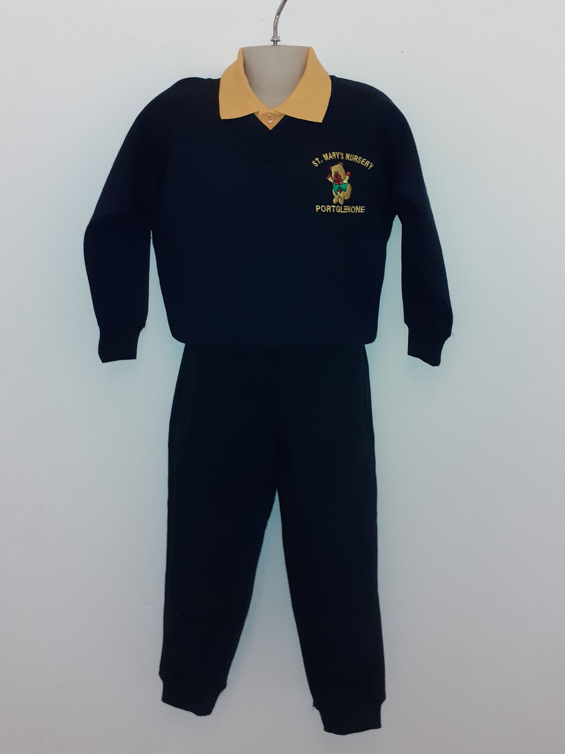 Black outfit with a yellow beanie on a white background