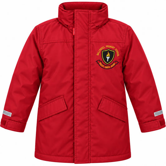 A red school coat with a high collar, front zipper, and two flap pockets. It features a 'Ballykeel Primary School' crest patch on the left chest and reflective silver bands on the sleeves, shown against a plain white background.