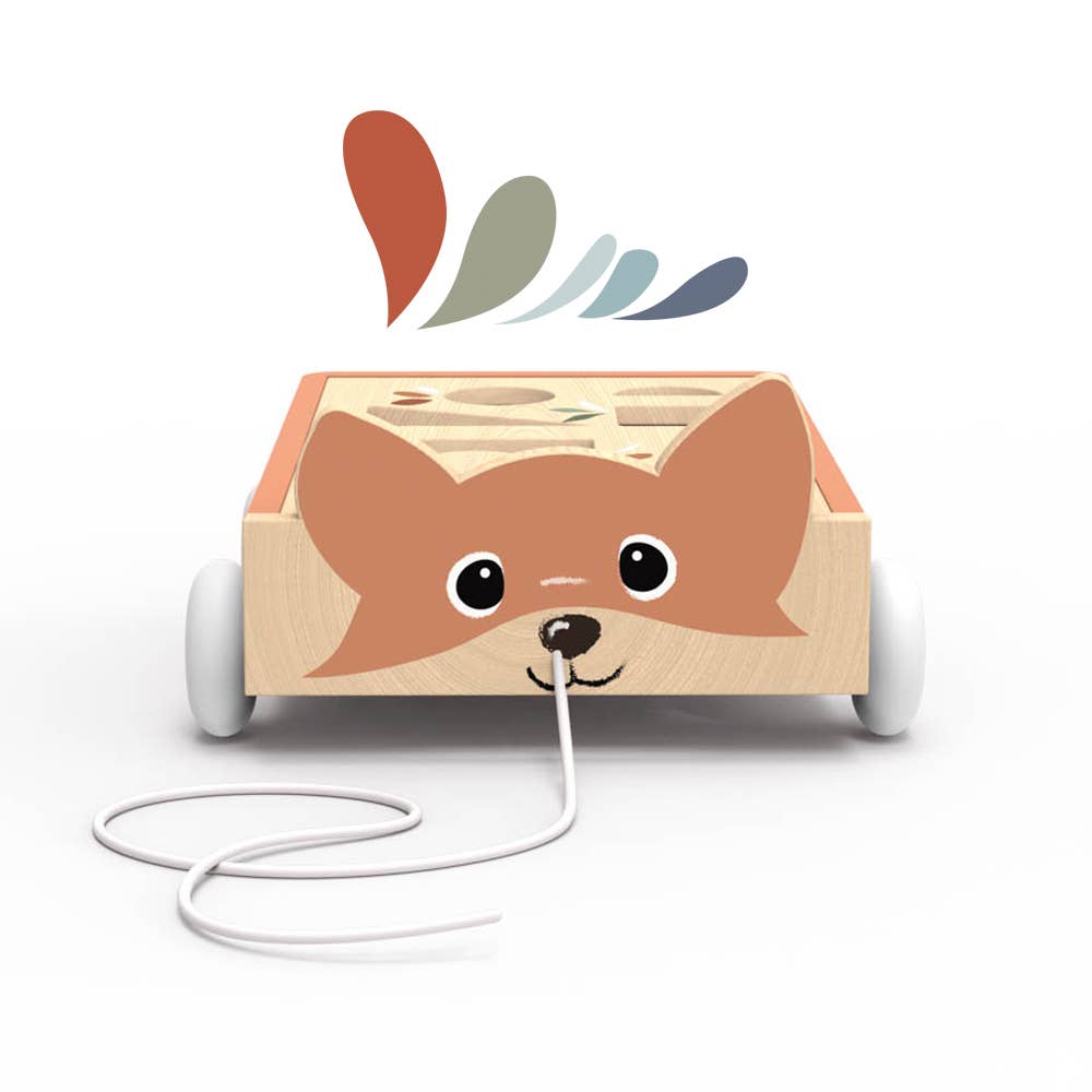 A wooden pull toy with a fox face on the front and colorful abstract shapes above, shown on a clean white background.