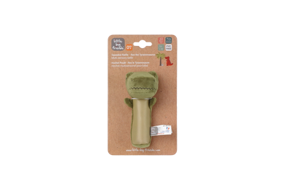 Green dino toy on a cardboard packaging with brand logo