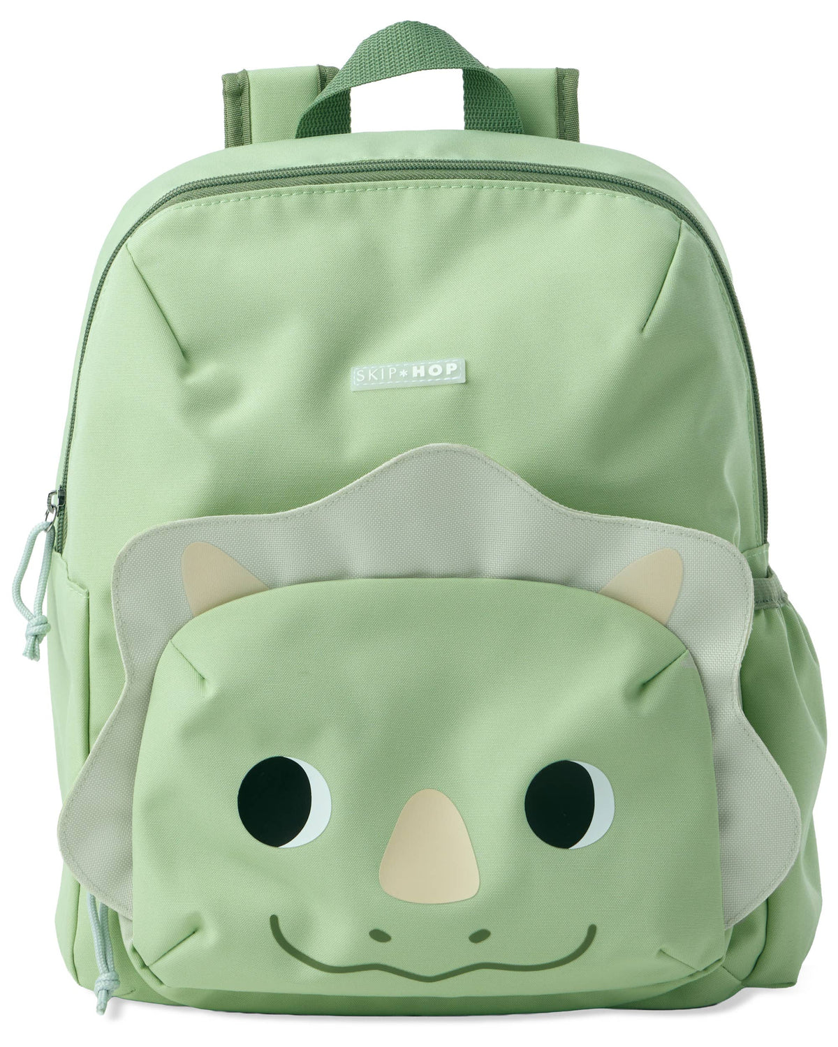 A light green backpack with a dinosaur face pouch on the front, featuring a beige horn and eyes
