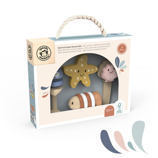 The set includes a wooden starfish, a pink seashell, a striped coral, and other ocean-themed wooden toys visible through the clear window.