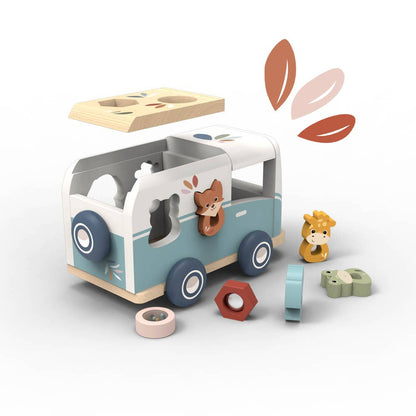 Wooden toy van with shape sorting elements on a white background