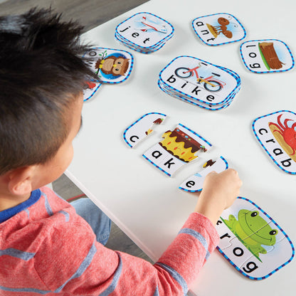 Child playing with educational word cards on a table