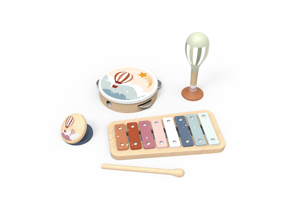  wooden toy music set on a white background, including a xylophone with colorful keys, a tambourine with a hot air balloon design, a maraca, and a small round wooden toy with a bunny face.